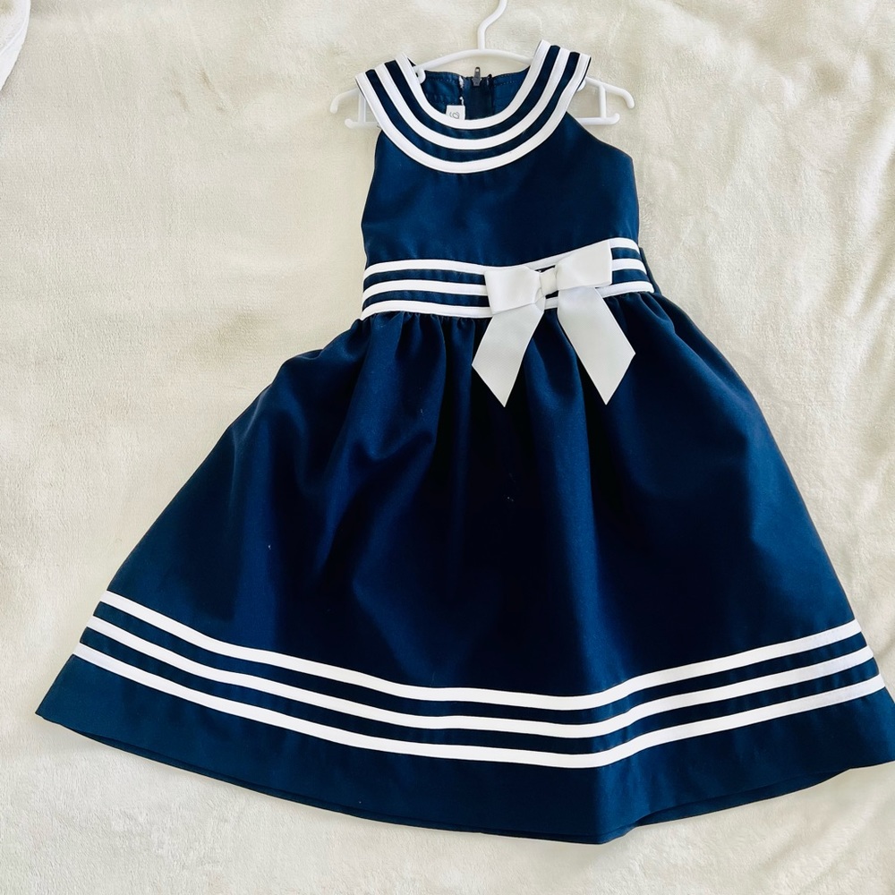 Truly adorable navy dress perfect for any occasion.